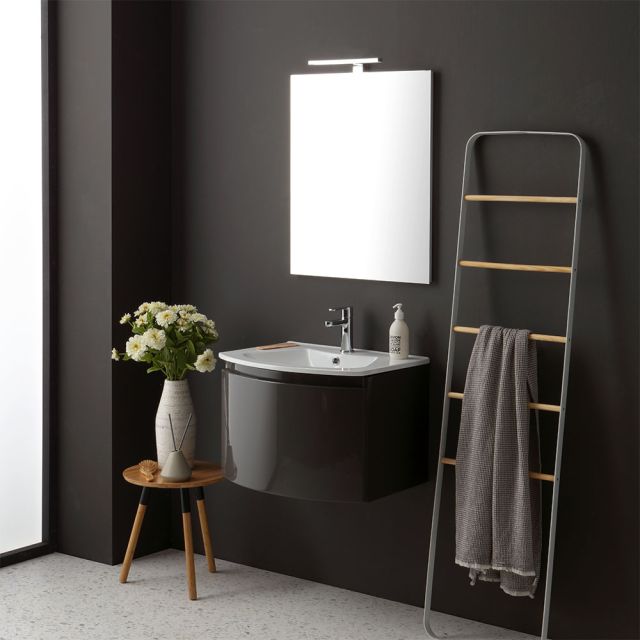 "Mueble de baño con lavabo suspendido de línea curva en color gris oscuro brillante."