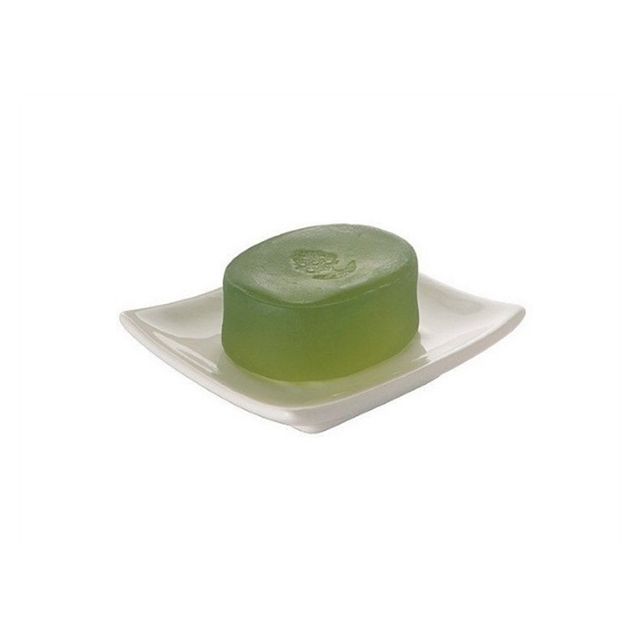 Jabonera de encimera en elegante cerámica blanca con forma cuadrada.